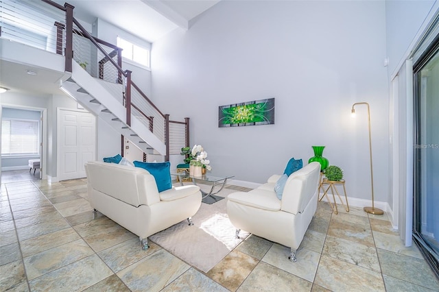 living room featuring a high ceiling