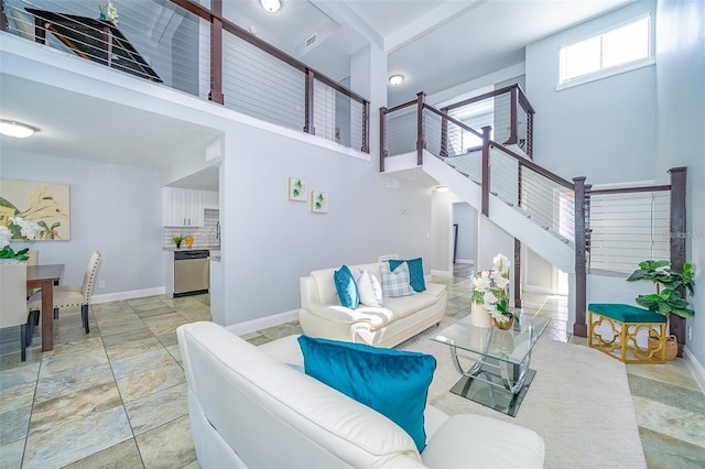 living room with a towering ceiling