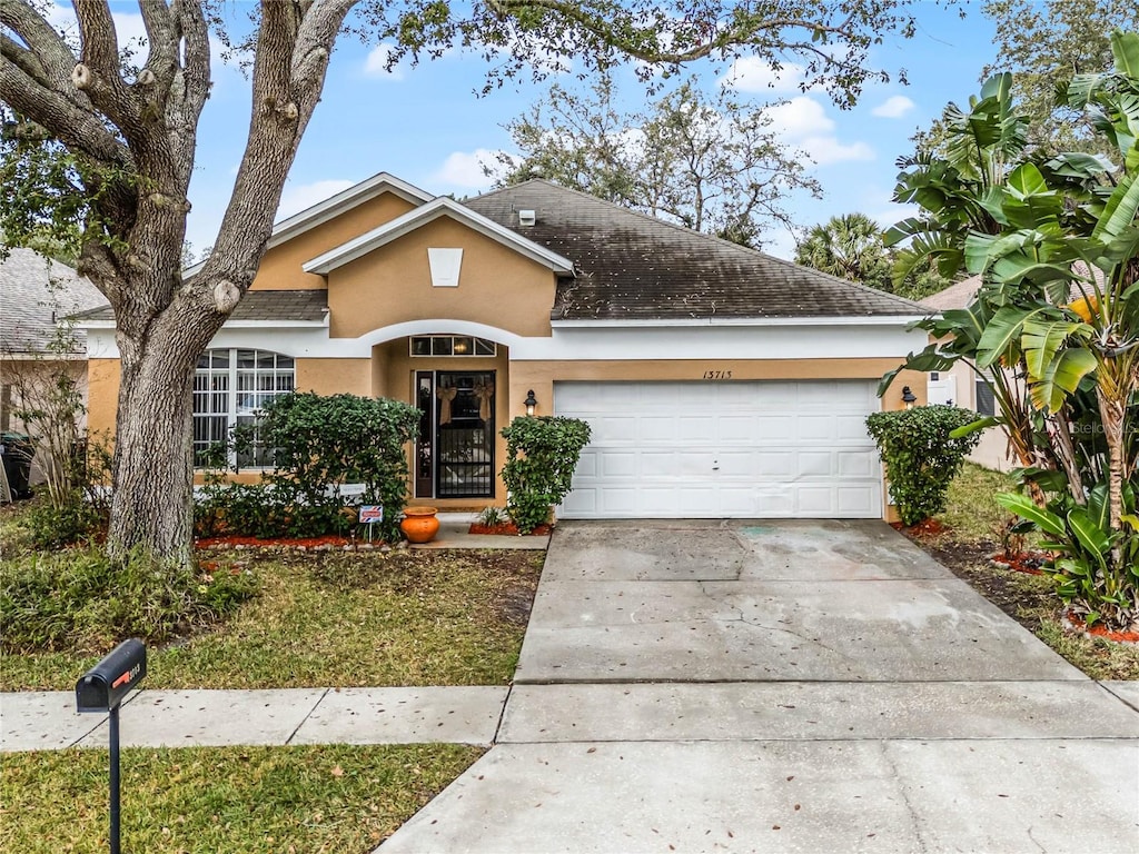 ranch-style home with a garage