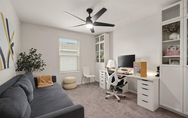 office with light carpet and ceiling fan