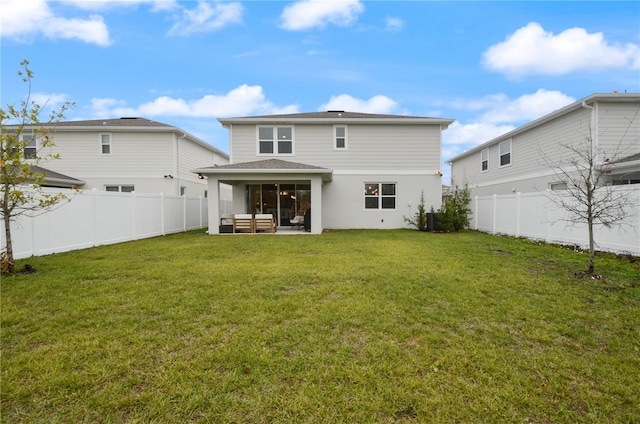 rear view of property with a patio, cooling unit, and a lawn