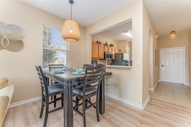 dining room with light hardwood / wood-style flooring