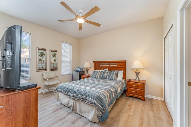 bedroom featuring a closet, ceiling fan, and light hardwood / wood-style flooring