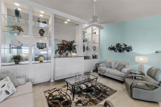 tiled living room with ceiling fan