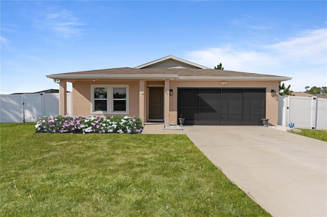 view of front of home with a garage and a front lawn