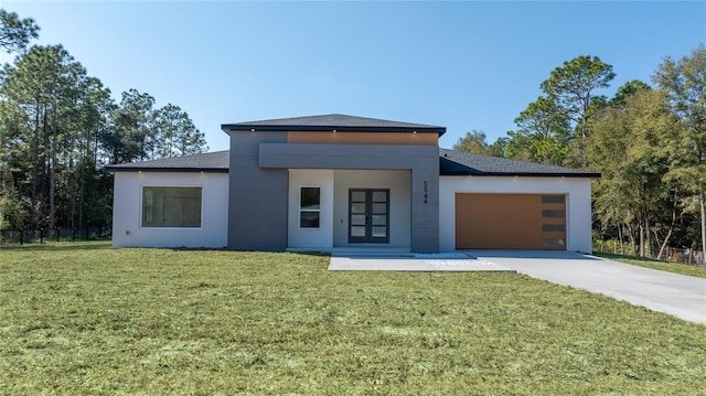 modern home with a garage and a front lawn