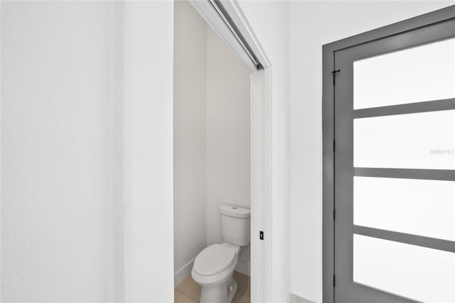 bathroom with tile patterned floors and toilet