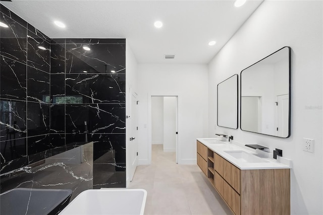 bathroom featuring vanity and a bathing tub