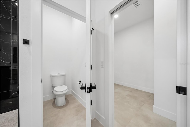 bathroom featuring toilet