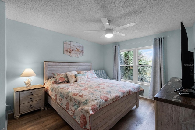 bedroom featuring a textured ceiling, dark hardwood / wood-style floors, and ceiling fan