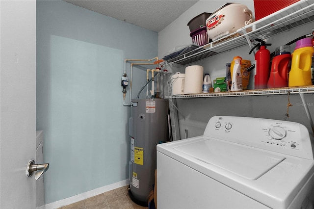 laundry room with washer / clothes dryer, water heater, and a textured ceiling