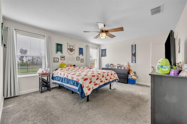 carpeted bedroom with ceiling fan