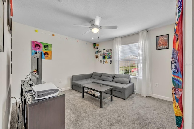 living room with light carpet, a textured ceiling, and ceiling fan