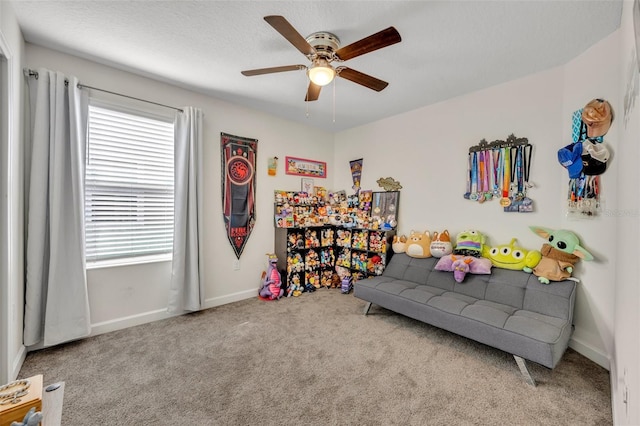 game room with carpet floors and ceiling fan