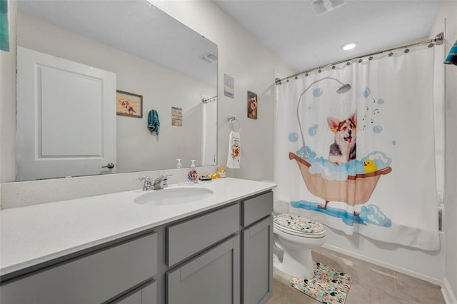 full bathroom featuring tile patterned flooring, vanity, shower / bath combination with curtain, and toilet