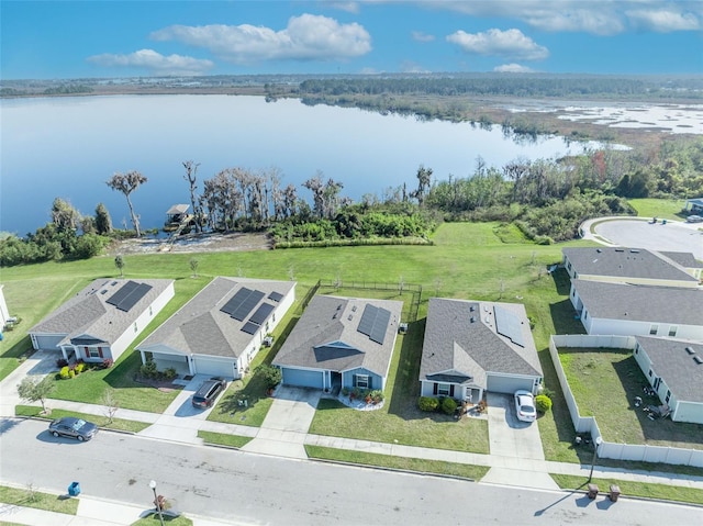 birds eye view of property with a water view