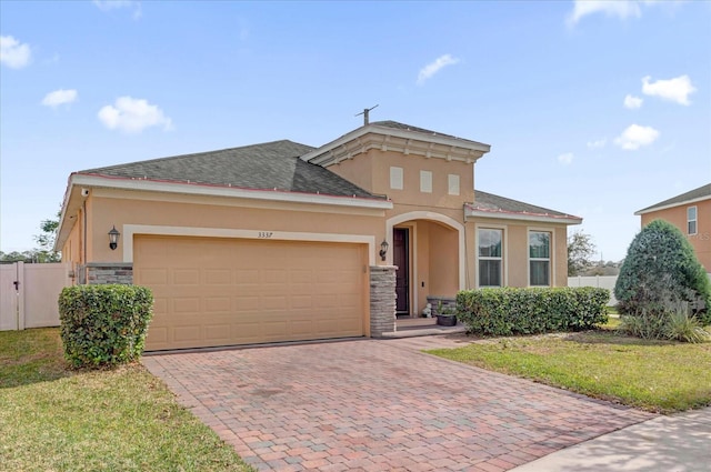 view of front of house with a garage and a front yard