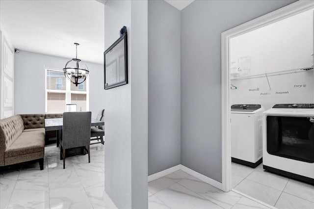 3337 Reedy Glen Dr, Kissimmee, FL 34758 - washroom featuring washing machine and clothes dryer and a chandelier