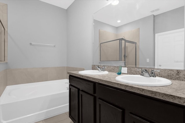 3337 Reedy Glen Dr, Kissimmee, FL 34758 - bathroom featuring vanity, tile patterned floors, and plus walk in shower