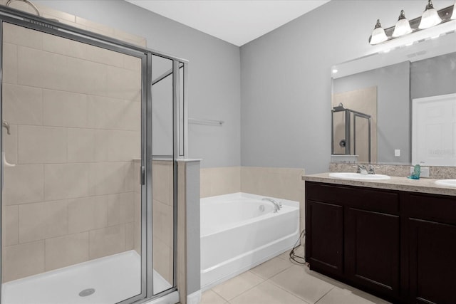3337 Reedy Glen Dr, Kissimmee, FL 34758 - bathroom featuring vanity, shower with separate bathtub, and tile patterned floors