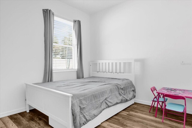 3337 Reedy Glen Dr, Kissimmee, FL 34758 - bedroom featuring hardwood / wood-style floors