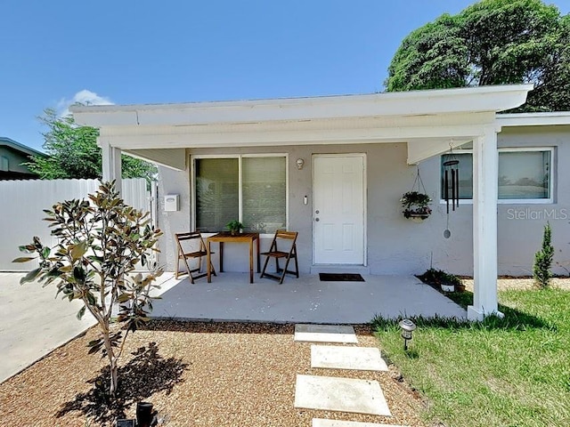 property entrance with a patio