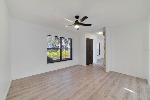 unfurnished room with ceiling fan and light hardwood / wood-style floors