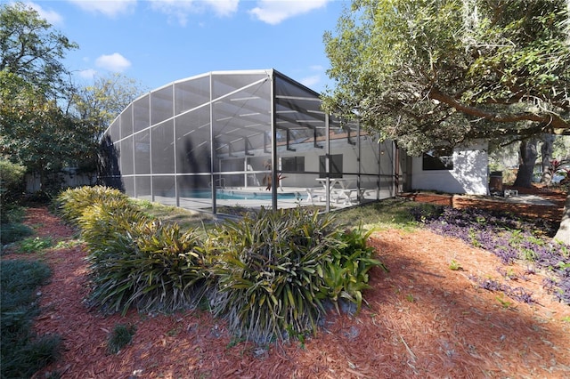 view of pool featuring a lanai