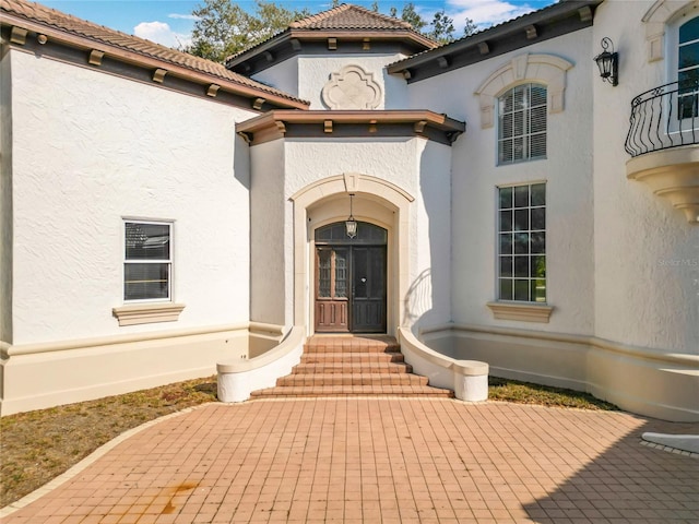 doorway to property with a patio area