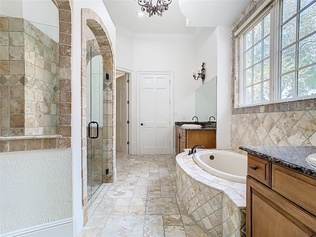 bathroom featuring vanity, crown molding, and plus walk in shower