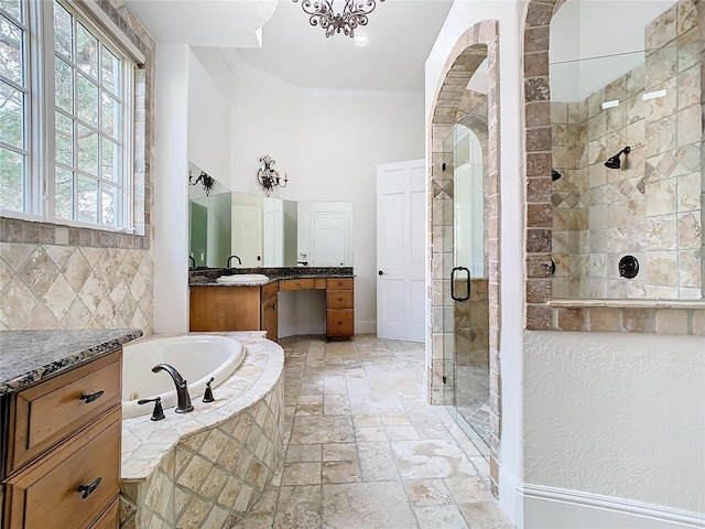 bathroom with vanity, backsplash, ornamental molding, and shower with separate bathtub