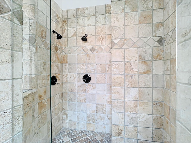 bathroom with tiled shower