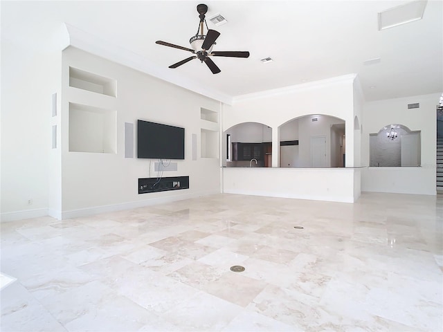 unfurnished living room with sink, crown molding, and ceiling fan