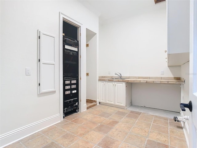 clothes washing area with sink