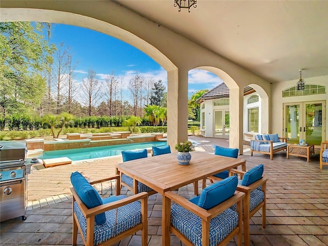 view of patio featuring french doors, ceiling fan, an outdoor living space, and a pool with hot tub