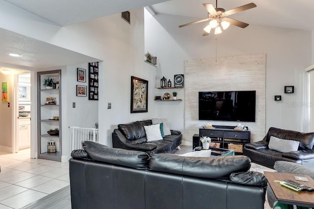 tiled living room with high vaulted ceiling, built in features, and ceiling fan