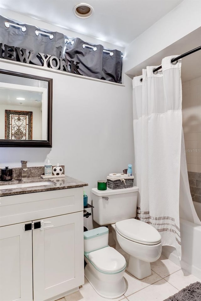 full bathroom featuring vanity, shower / bathtub combination with curtain, tile patterned floors, and toilet