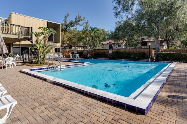 view of swimming pool featuring a patio area