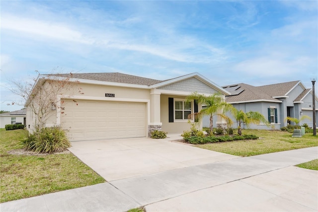 single story home with a garage, a front lawn, and solar panels