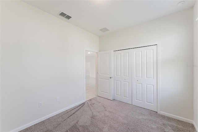 unfurnished bedroom with light carpet