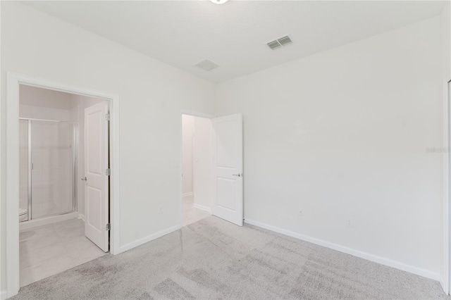 unfurnished bedroom with light carpet