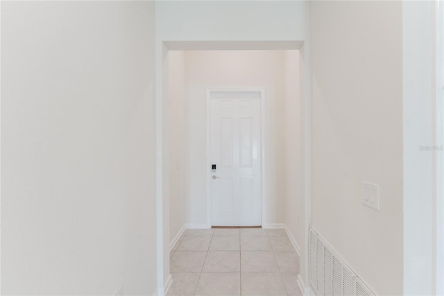 hallway with light tile patterned floors