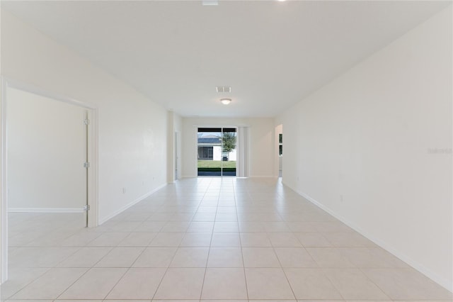 unfurnished room featuring light tile patterned floors