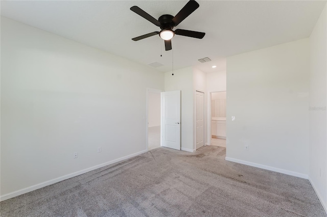 carpeted empty room with ceiling fan