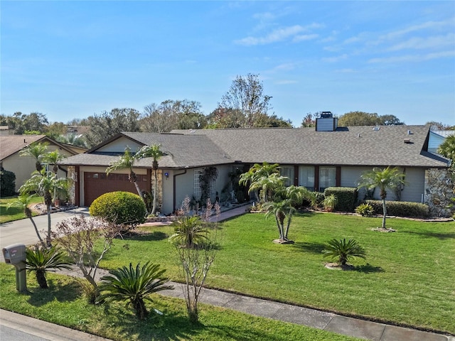 ranch-style home featuring a garage and a front yard