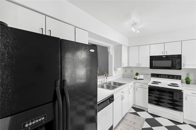 kitchen featuring white cabinetry, sink, a textured ceiling, and black appliances