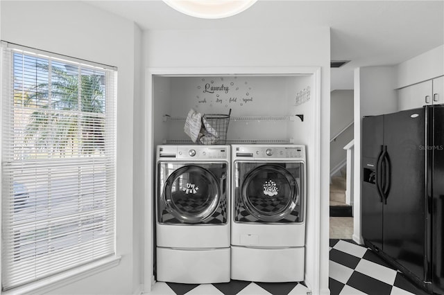 washroom featuring washer and dryer