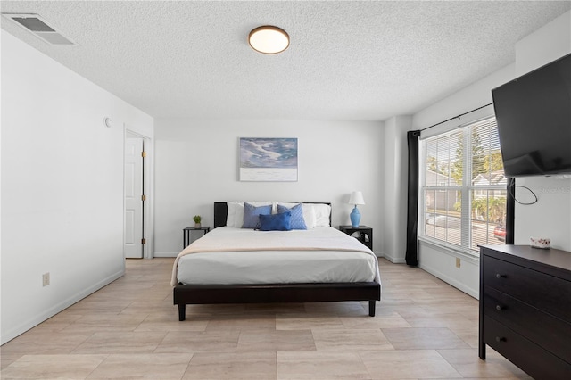 bedroom featuring a textured ceiling