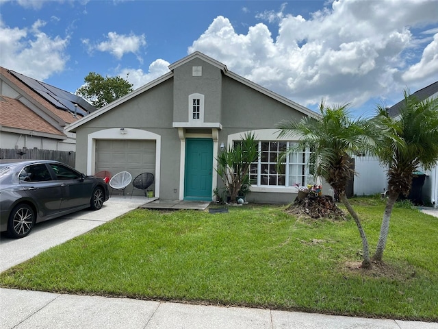 view of front of house with a garage and a front lawn