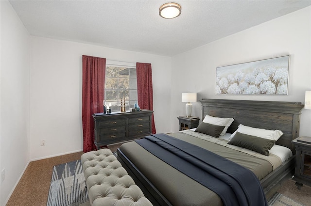 carpeted bedroom featuring a textured ceiling